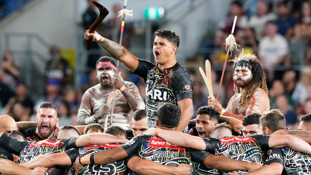 Latrell Mitchell at the centre of the Indigenous All Stars war cry prior to their clash with the Maori.