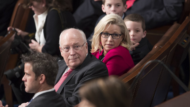 Former vice-president Dick Cheney, left, sits with his daughter, then-newly-elected Representative Liz Cheney in 2017.