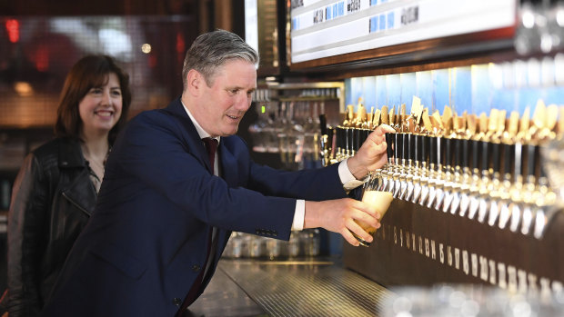 Labour leader Keir Starmer visits a pub last summer.