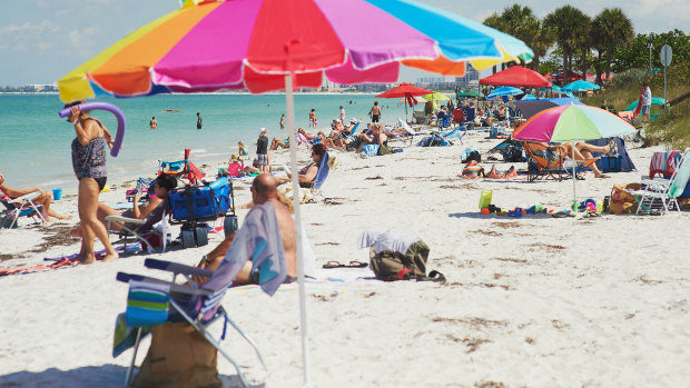People returned to Clearwater Beach on Florida's Gulf Coast on Monday after all beaches in Pinellas County reopened for the first time in six weeks. 
