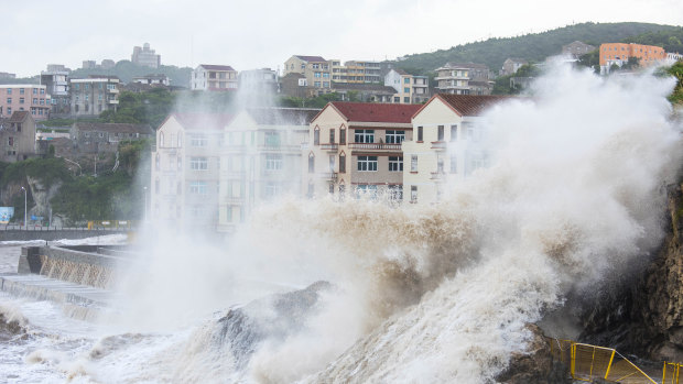 Large waves crash against the shoreline as typhoon Maria approaches Wenling city in eastern China's Zhejiang Province.