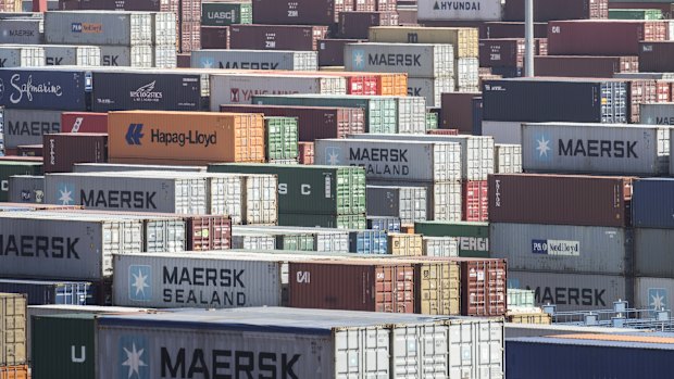 Containers sit stacked at the Yangshan Deep Water Port in Shanghai, China.