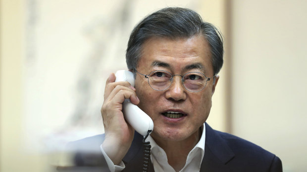 Phone a friend: South Korean President Moon Jae-in on the phone to Donald Trump on Thursday.