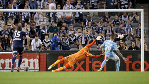 Melbourne City's Jamie Maclaren nails the penalty.