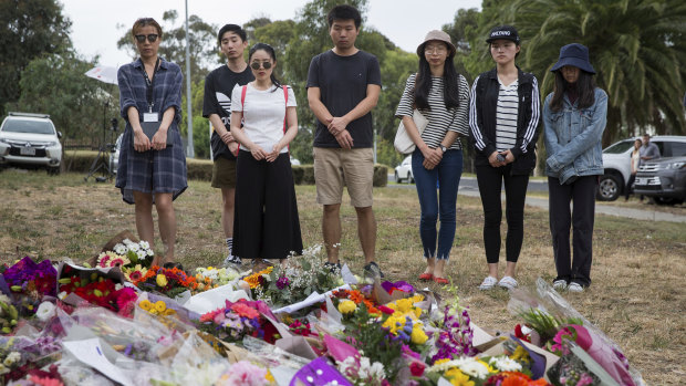 A group of LaTrobe University students and teachers have paid tribute Aiia Masarwe by laying flowers where body was found on Wednesday in Bundoora.