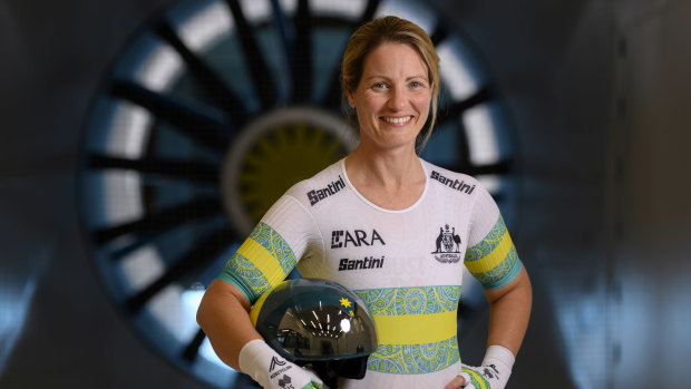 Emily Petricola in front of the wind tunnel.