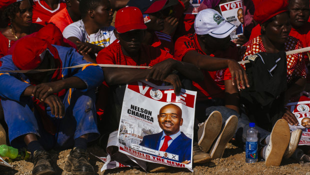 A supporter holds a placard showing Nelson Chamisa, leader of the Movement for Democratic Change (MDC), during a campaign rally in Harare, Zimbabwe, on Saturday.