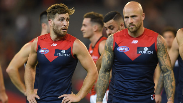 Jack Viney and Nathan Jones can't hide their disappointment after the loss to Essendon.