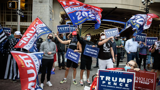 Trump supporters gather in front of the Convention Center, where votes are being counted, in Philadelphia.
