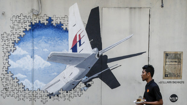 A mural for MH370. Malaysia's transport minister says the private search for the missing plane will end next week.