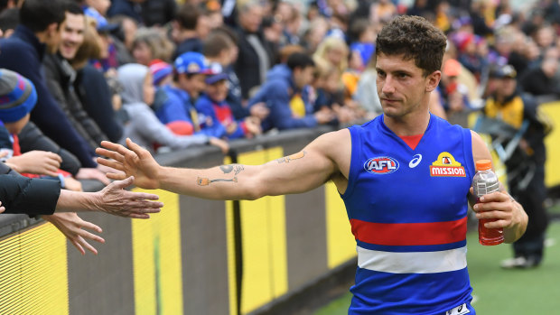 Tom Liberatore celebrates the Bulldogs' round-two win with fans.