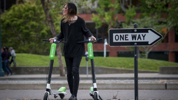 Coming to a footpath near you: Lime scooters. And possibly a pedestrian moving them.