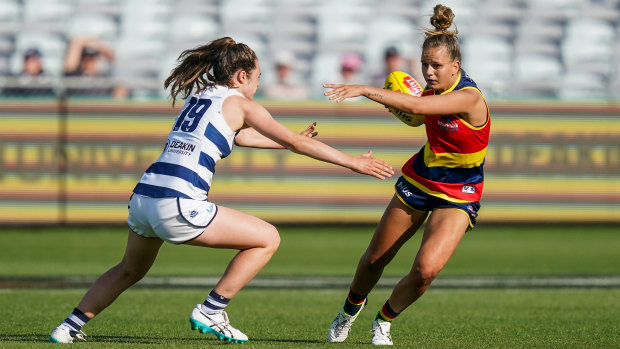 Catch me if you can: Adelaide's Danielle Ponter escapes a tackle from Millie Brown of Geelong.