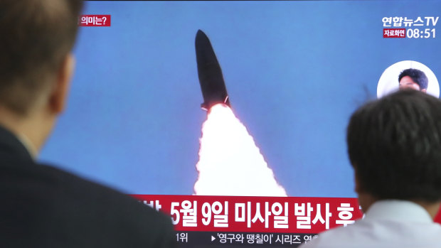 South Koreans watch a TV showing a report of a North Korea missile launch in an undated picture.