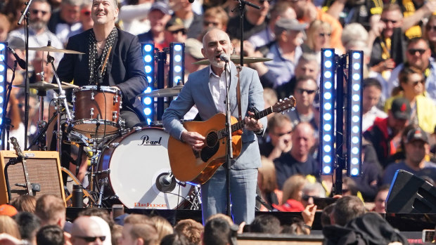 On song: Paul Kelly brings poetry and passion to the grand final entertainment.  
