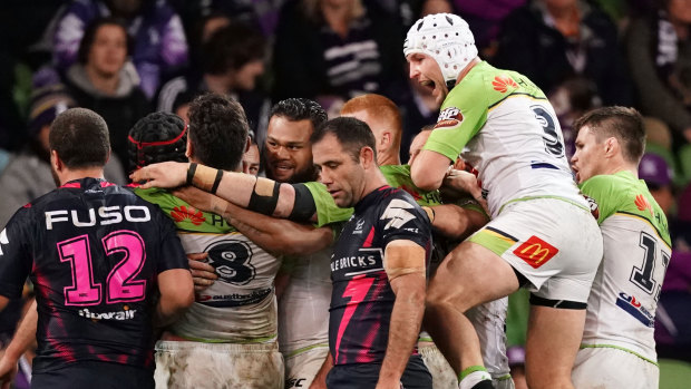 The Raiders celebrate the match-winning try over Storm.