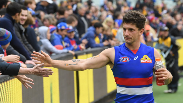 Tom Liberatore celebrates the Bulldogs' round-two win with fans.