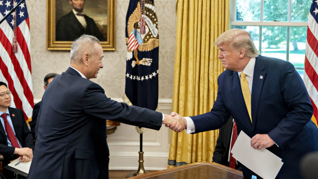 Donald Trump shakes hands with Liu He, China's vice-premier, during a meeting in the Oval Office.  Markets were buoyed by improved relations between the two countries.