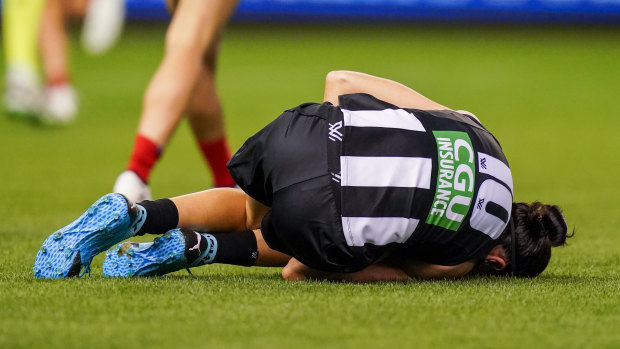 Down and out: Collingwood's Ashleigh Brazill.