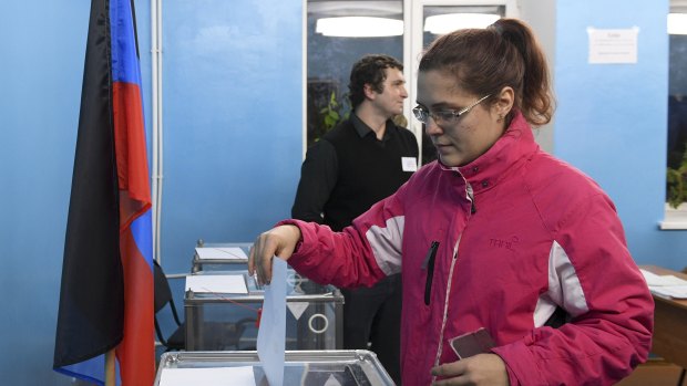 A woman casts her ballot at a polling station during rebel elections in Donetsk, Ukraine.