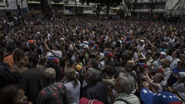 Attendees gather for a rally in the Chacao neighbourhood in Caracas, where Guaido took questions from local and international media outlets. 