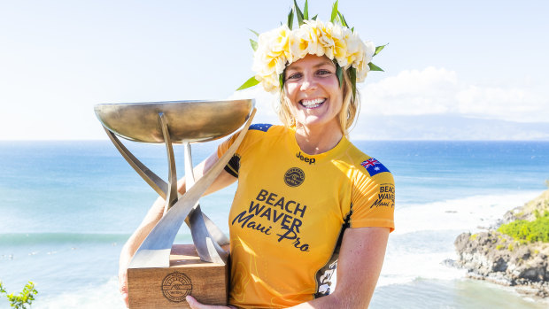 Spoils of victory: Stephanie Gilmore celebrates her record-equalling seventh world championship.