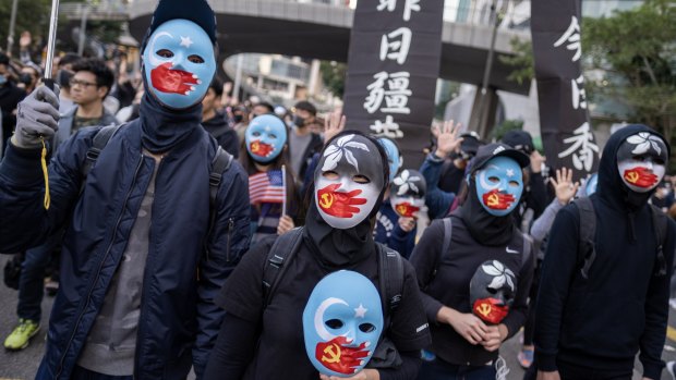 Demonstrators wear face masks during the protest.