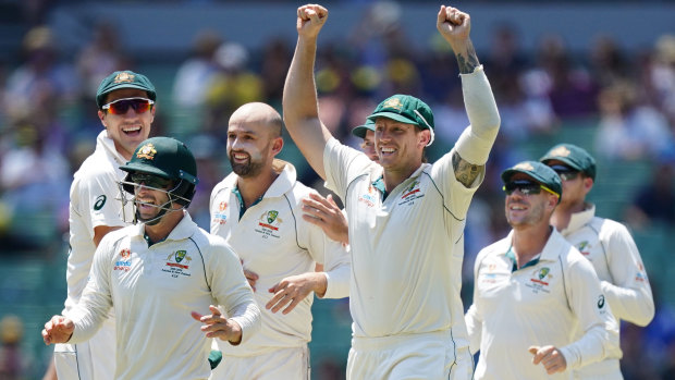 Spinning up a win: Pat Cummins, Matthew Wade, Nathan Lyon, James Pattinson and David Warner celebrate after Tim Paine stumped New Zealand's Henry Nicholls to seal a series victory for the hosts on day four of the Boxing Day Test at the MCG.
