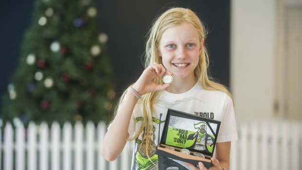 The first coin strike of 2019 is given to winner Celeste Weerts, pictured, at the Royal Australian Mint.