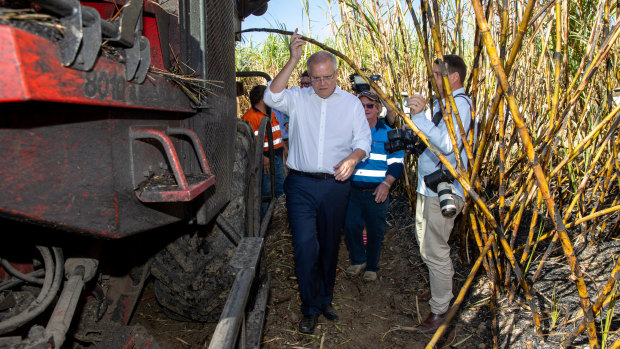 Mr Morrison during a visit with harvesting contractor Gary Stockham on a Burdekin sugar cane farm.