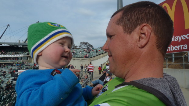Toby Jamieson with son William at a Raiders game in 2013.