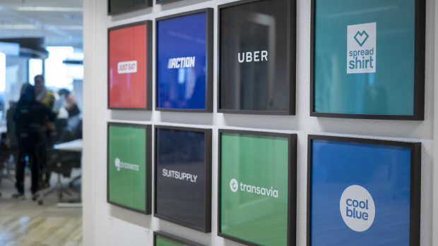 Framed global client logos sit on a wall inside the Adyen headquarters in Amsterdam.