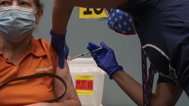 A person receives a COVID-19 vaccine in Texas. 