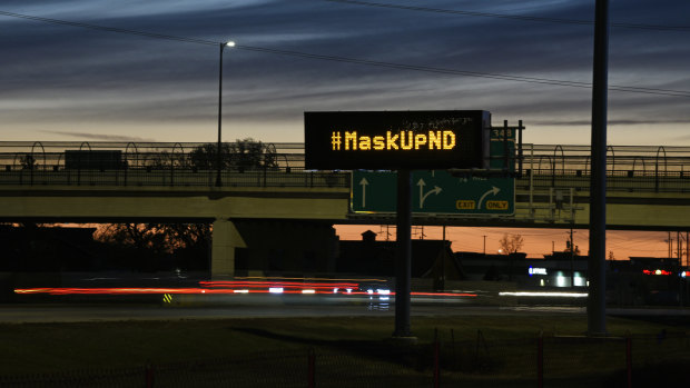 A sign in Fargo this month encouraging drivers to wear a mask. On Monday, the mayor used his emergency powers to issue a mandatory mask order.