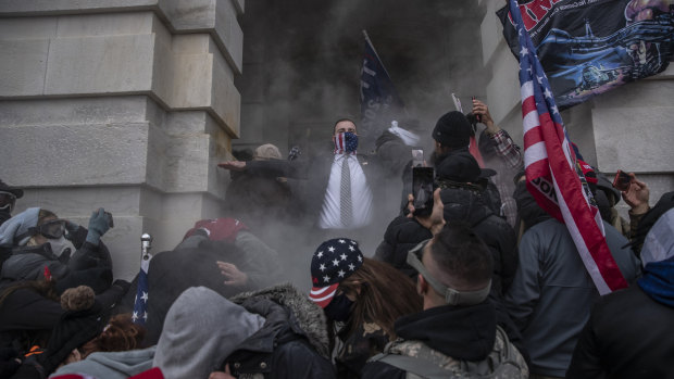 Demonstrators attempt to breach the US Capitol after they earlier stormed the building 