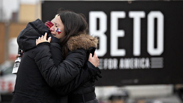 Supporters of Beto O'Rourke embrace after the news.
