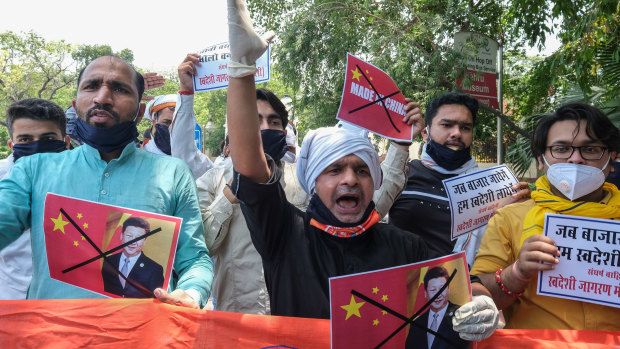 Activists from Swadeshi Jagran Manch, a wing of the Hindu nationalist organisation Rashtriya Swayamsevak Sangh (RSS), shout slogans during a protest outside the Chinese Embassy in New Delhi, India.