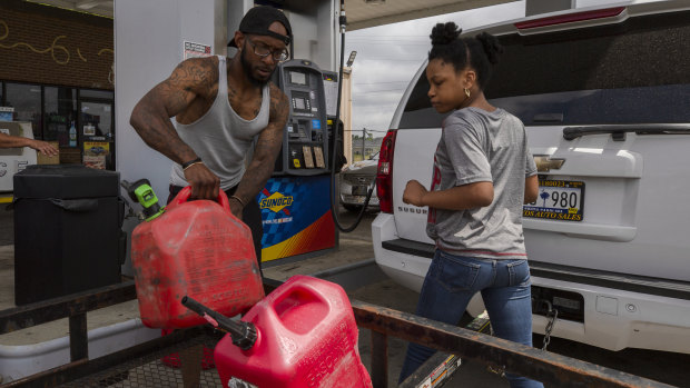 Shortages: A man fills a jerry can with fuel at a Sunoco petrol station in Sumter, South Carolina. 