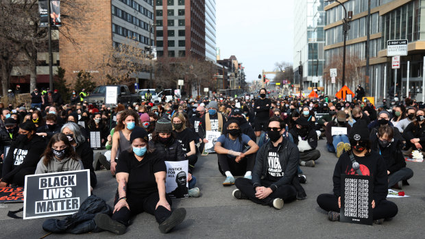 Demonstrators sit for a moment of silence during a protest in Minneapolis, Minnesota, US. 