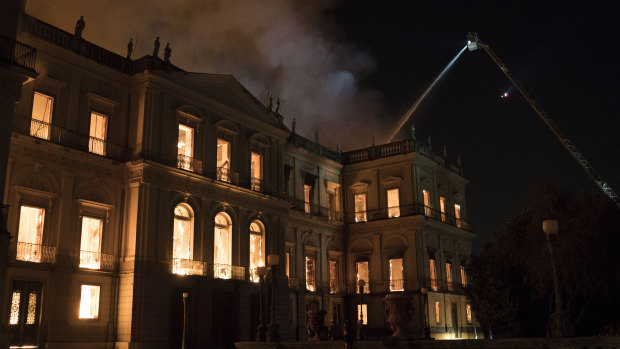 Firefighters work the fire  on Sunday. 