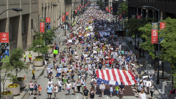 People participate in the 'Families Belong Together' march in Chicago on Saturday.