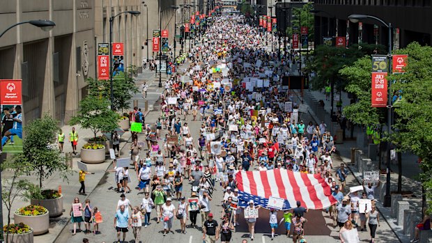 People participate in the 'Families Belong Together' march in Chicago on Saturday.