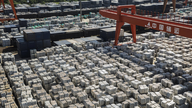 Bundles of aluminum ingots sit stacked at a China National Materials Storage and Transportation Corp. stockyard in Wuxi, China.