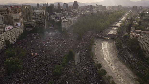 People gather during an anti-government protest in Santiago, Chile.