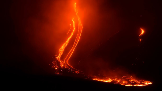 Mount Etna volcano spews lava during an eruption early on Christmas Day. 