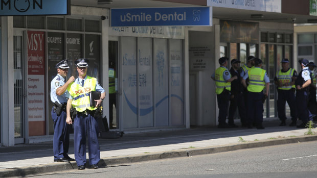 Police investigators at the scene on Forest Road. 