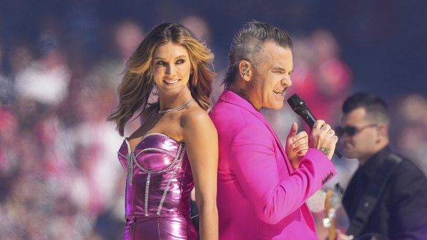 Robbie Williams with Delta Goodrem at the grand final.