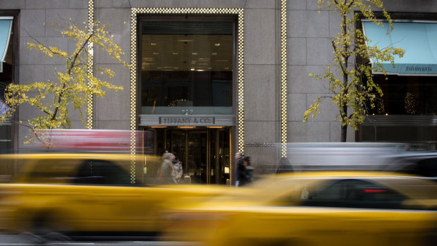 Taxi cabs drive past Tiffany's on 5th Avenue in New York.