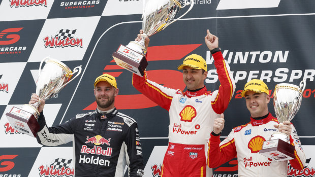 Upset: Shell V-Power's Fabian Coulthard (centre) claims victory over his team-mate Scott McLaughlin (right)