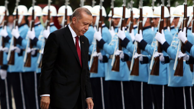 Amassing power: Recep Tayyip Erdogan, Turkey's President, inspects an honour guard after being sworn in under a new system of government at the Grand National Assembly of Turkey in Ankara.